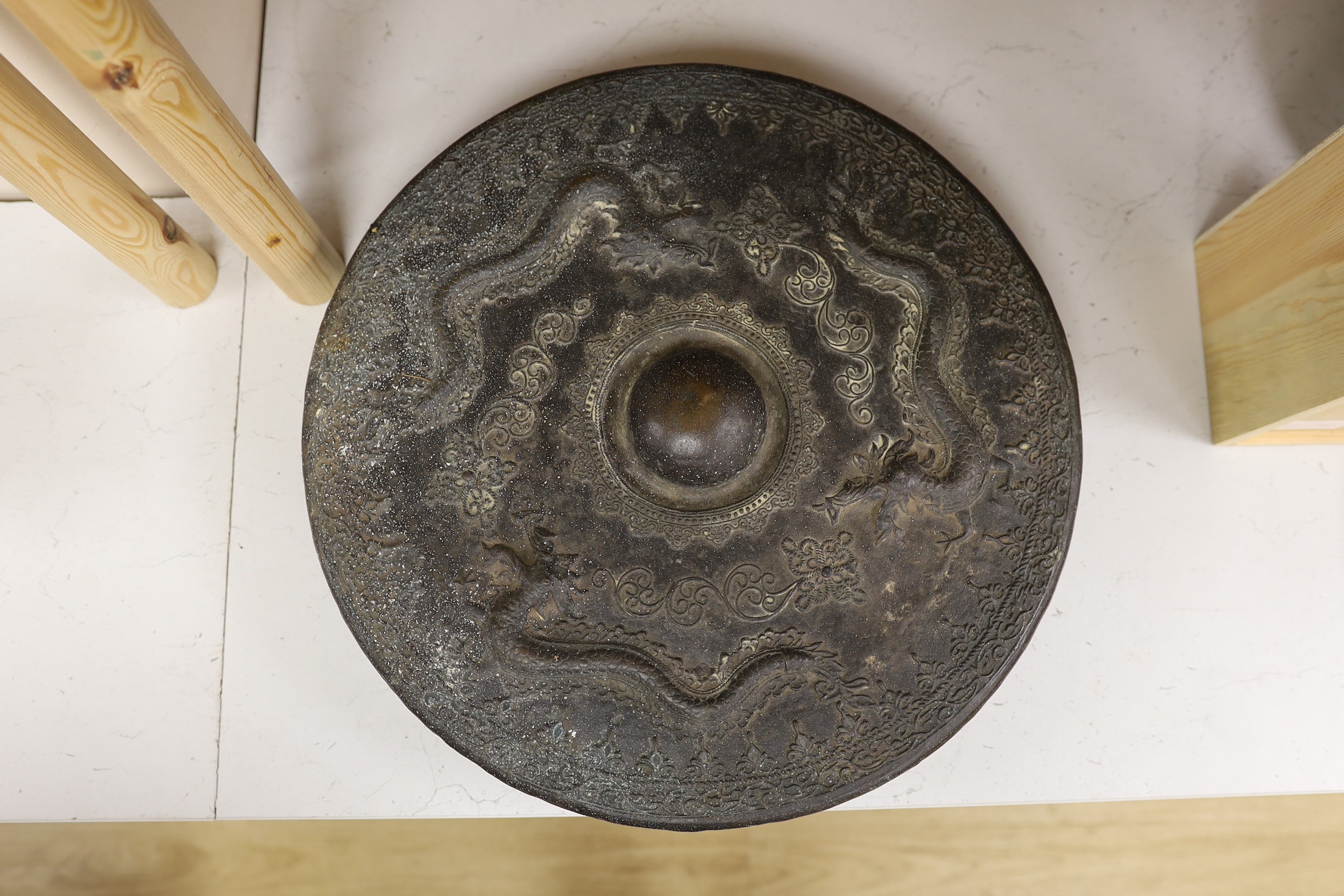 Two 19th century Borneo bronze gongs, Tawak-Tawak, largest 42cm diameter